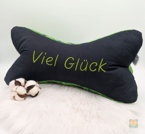 Kissen mit Aufschrift 'Viel Glück' aus Baumwolle.